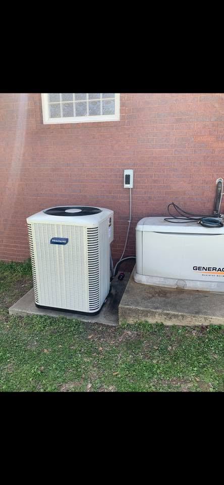 New outdoor AC condenser installed at a brick home