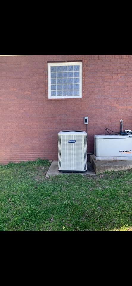 AC condenser installed at a commercial brick building
