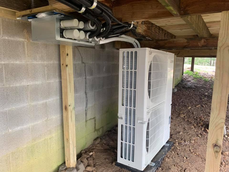 Mini-split outdoor unit installed in a crawlspace