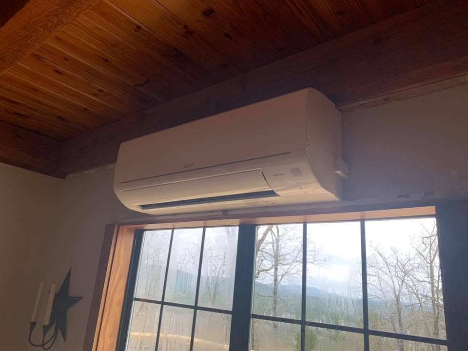 Mitsubishi ductless mini-split head installed in a cabin